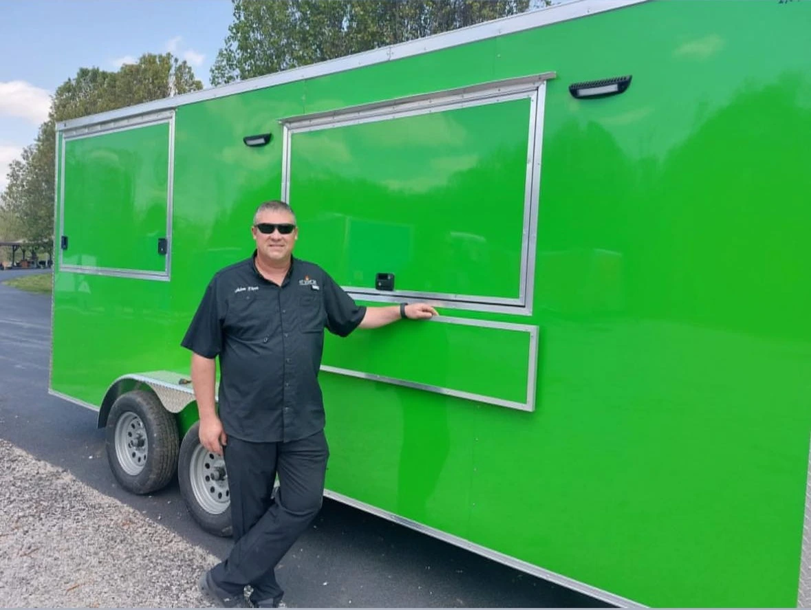 Man standing front of a food truck